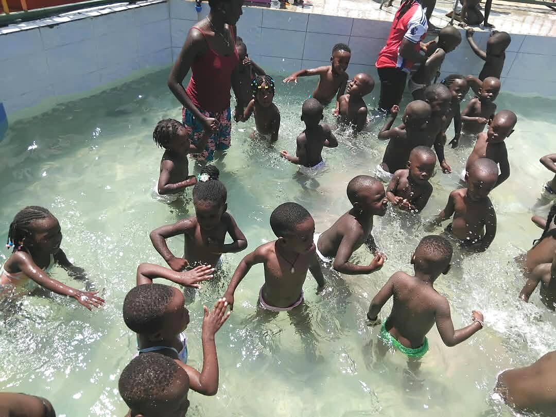 Children play together in the water.