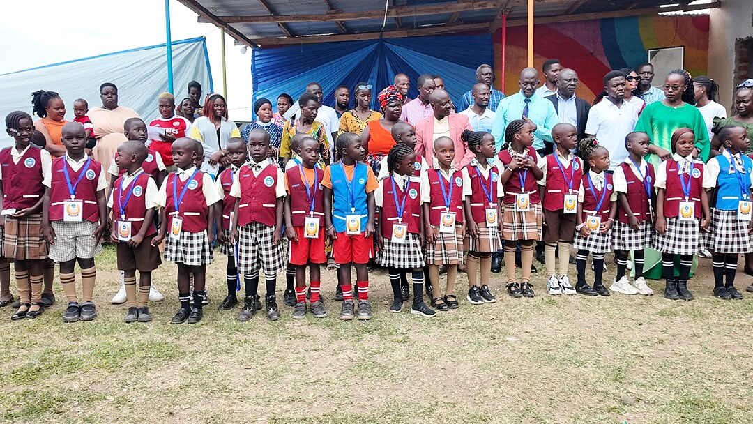 Schoolchildren stand together at a gathering.